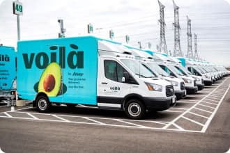 An image representing Voilà by Sobeys fleet parked outside the Customer Fulfilment Centre in Vaughan, Ontario