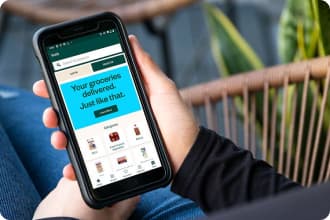 An image representing customer using Voilà by Sobeys mobile app to place orders.