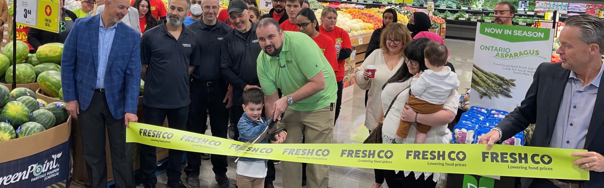 An image representing ribbon cutting ceremony of FreshCo grocery store.